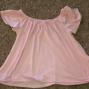 Pink off the shoulder shirt.